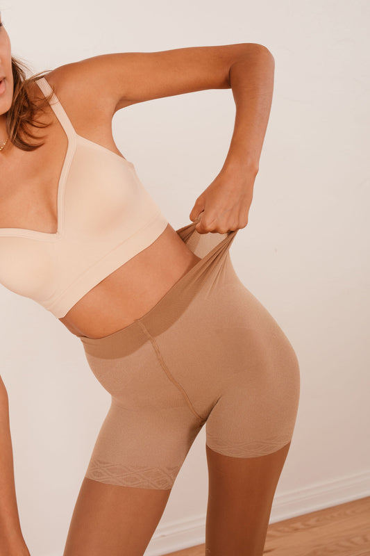 Sheer tan contour tights by Anastasia's Bedroom Lingerie, close-up of smooth, lightweight hosiery with subtle contouring details.