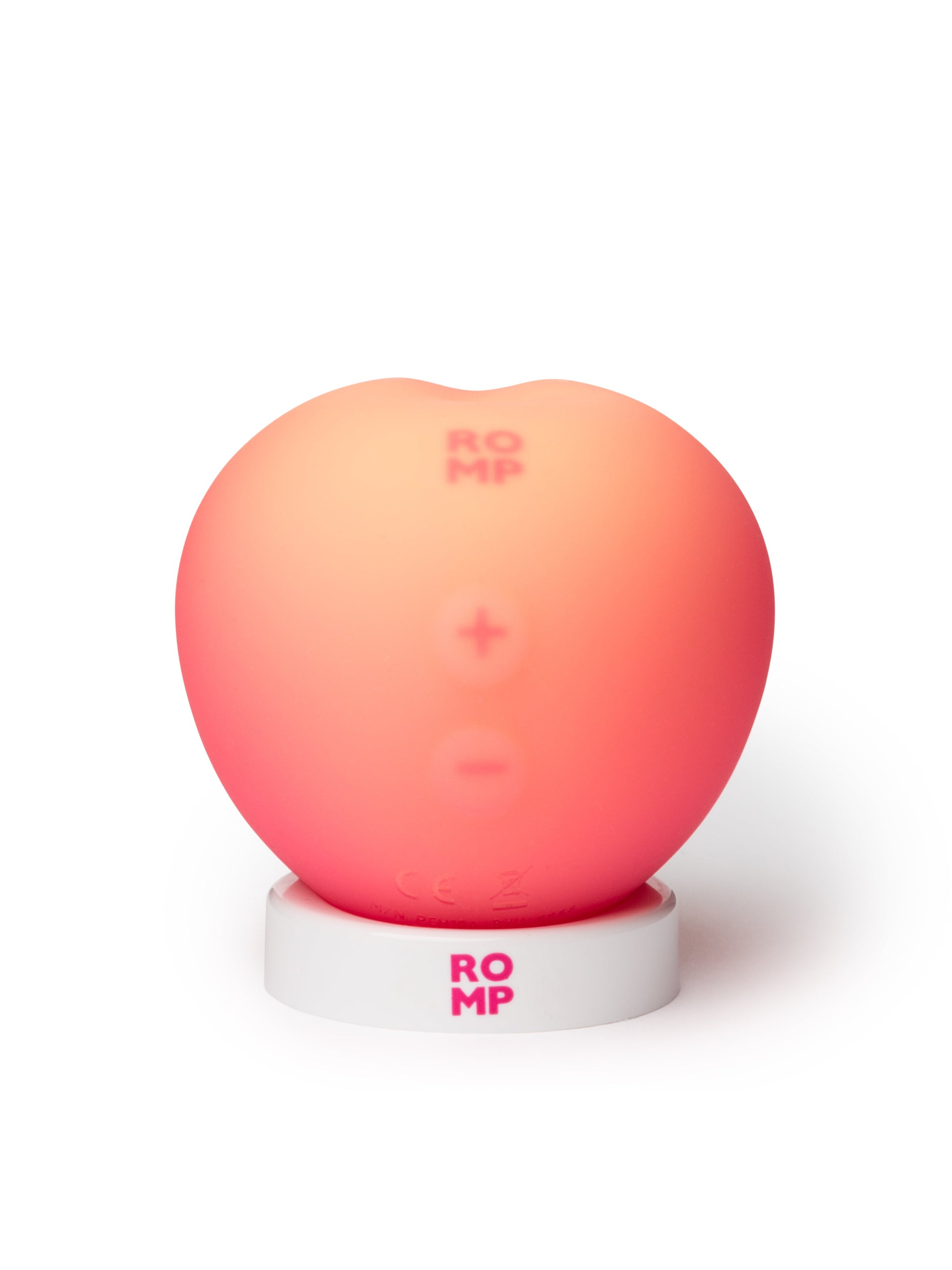 ROMP Pink Peach vibrator shown, featuring smooth silicone surface and ergonomic design for versatile pleasure.