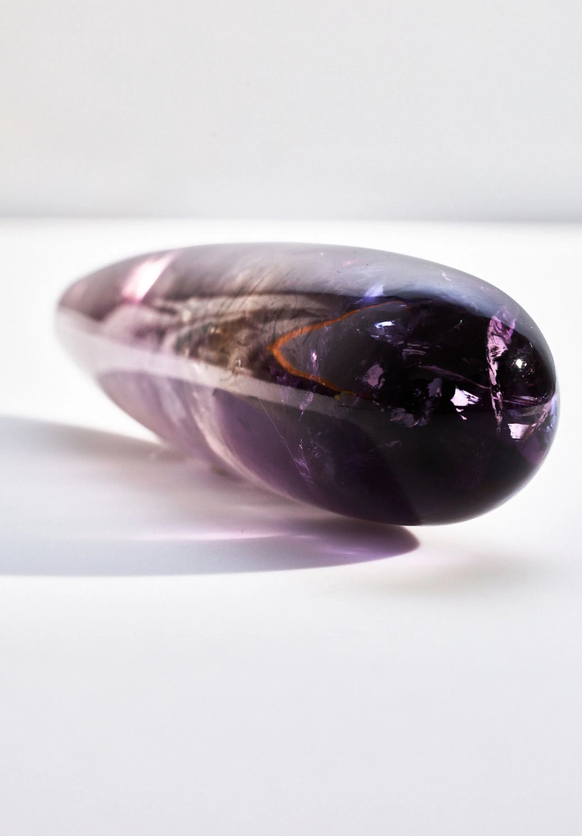 Amethyst crystal wand from Anastasia's Bedroom Lingerie with a polished purple gemstone and intricate design details.