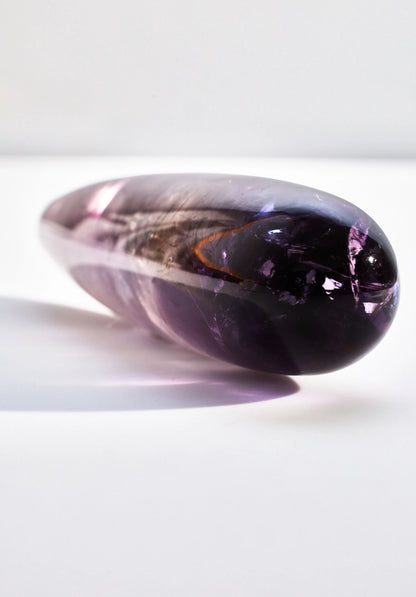 Amethyst crystal wand from Anastasia's Bedroom Lingerie with a polished purple gemstone and intricate design details.