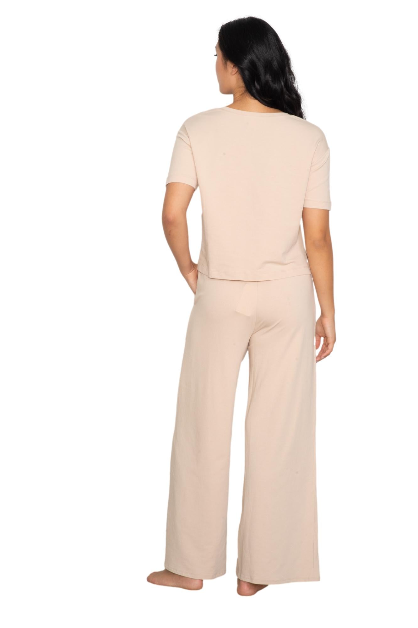 Anastasia's Bedroom Lingerie V-neck tee and wide-leg lounge pant set in soft fabric, displayed on a hanger against a neutral background.