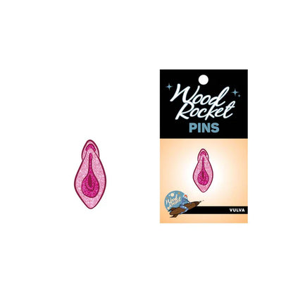 Sparkly pink enamel pin featuring a vulva design from Anastasia's Bedroom Lingerie, with detailed glitter accents and vibrant colors.