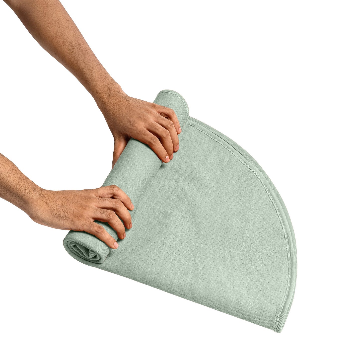 Dame sage-colored throw blanket with matching storage bag, soft and cozy accessory for home decor.