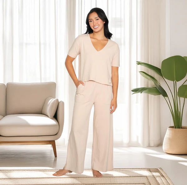 Anastasia's Bedroom Lingerie V-neck tee and wide-leg lounge pant set, soft fabric in neutral tones, laid flat for display.